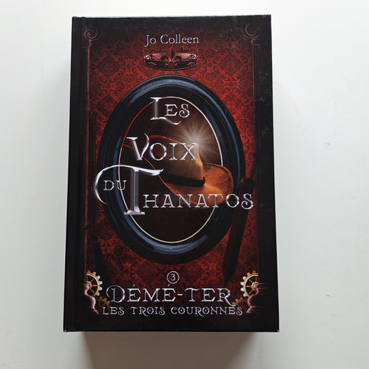 Les voix du Thanatos (Démé-Ter, les trois couronnes T.3) - Relié - Occasion